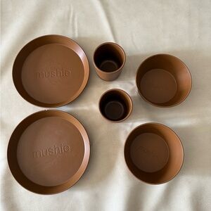 Mushie set of plates, cup, and bowls.